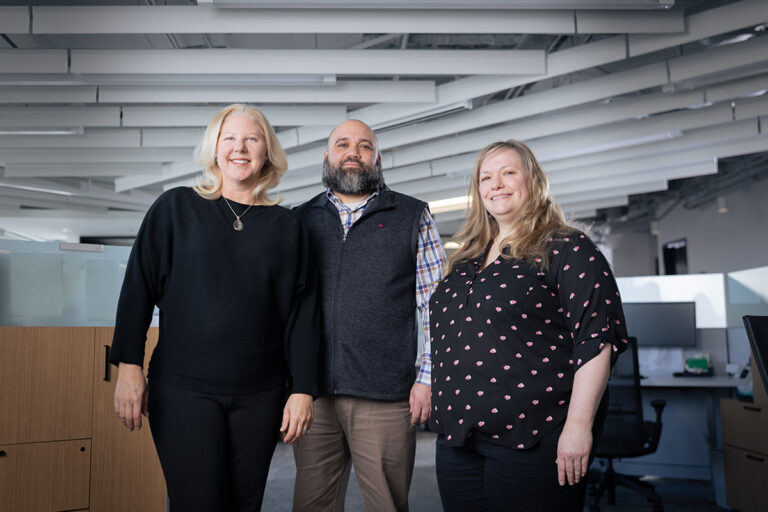Anne G standing with other Stepan Company team members