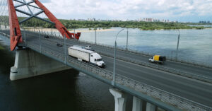 vehicles driving on a road across a bridge