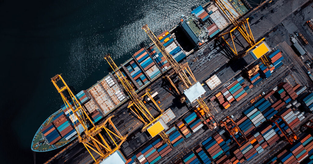 A ship loaded with cargo containers at a shipping port