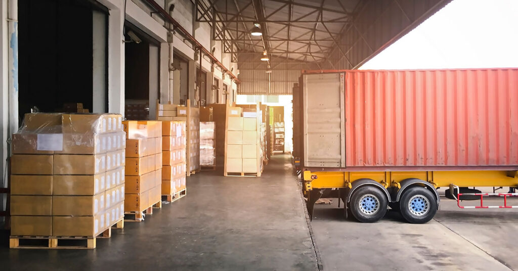 a trailer backed up to a warehouse loading dock