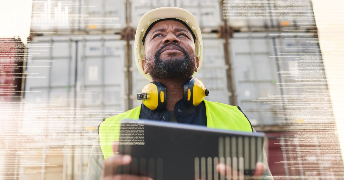 man using technology for supply chain visibility in shipping yard