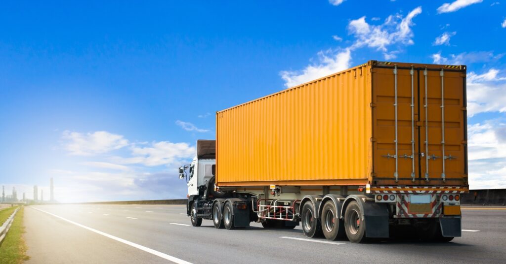 truck hauling containerized cargo