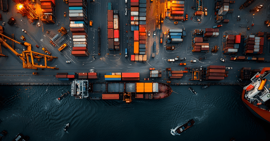 An aerial panoramic view of a thriving multimodal transportation nexus a seamlessly integrated network of highways railyards and active port facilities with freight trucks