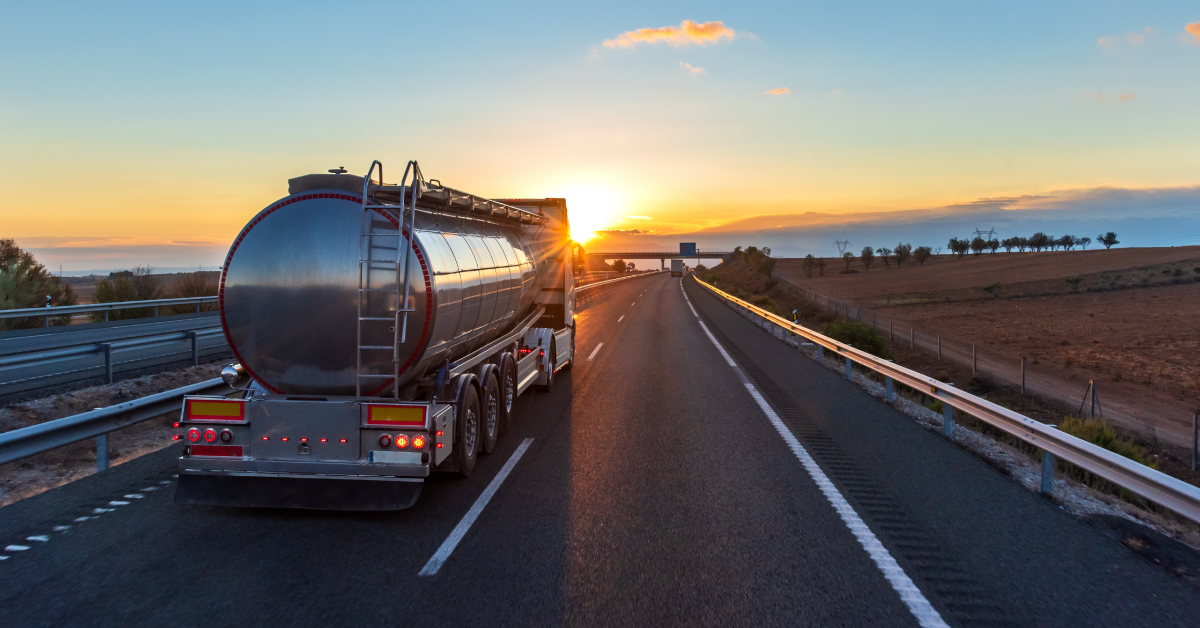 semi truck and trailer driving down a highway