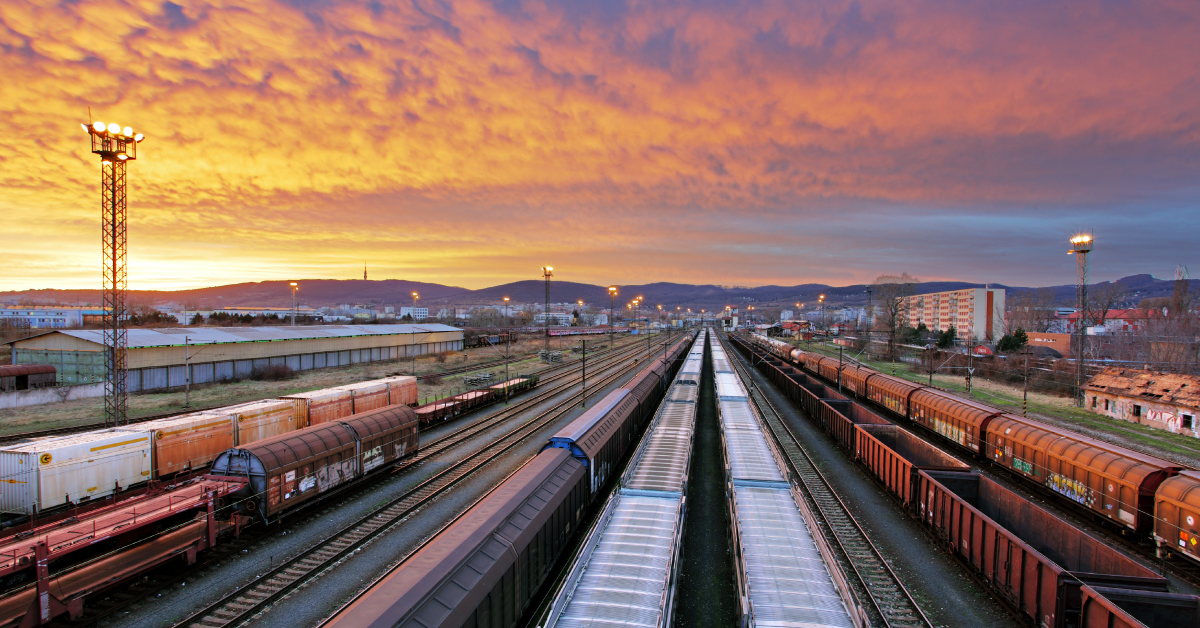 sun setting down on the trainyard