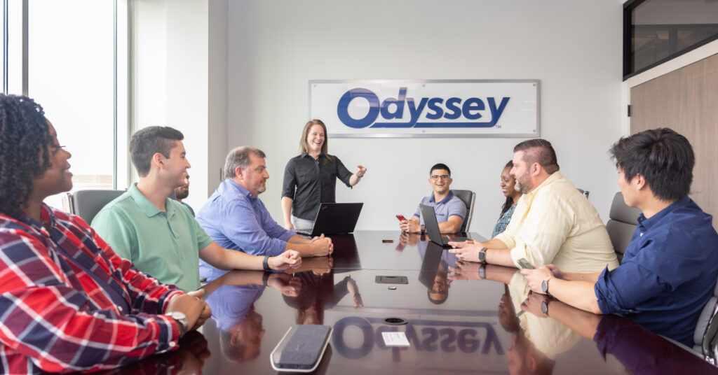 Odyssey Logistics employees in an engaging meeting