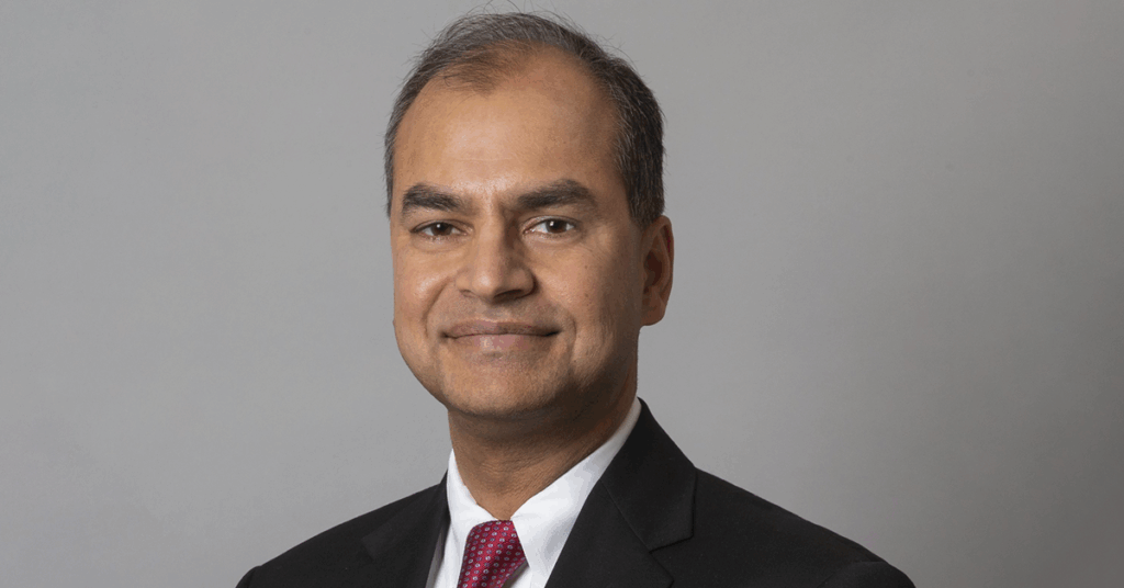 A professional headshot of Ravi Tulsyan