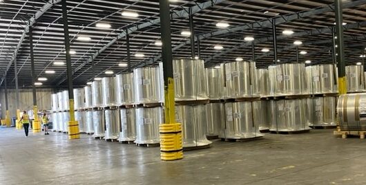 metal coils stacked in a warehouse