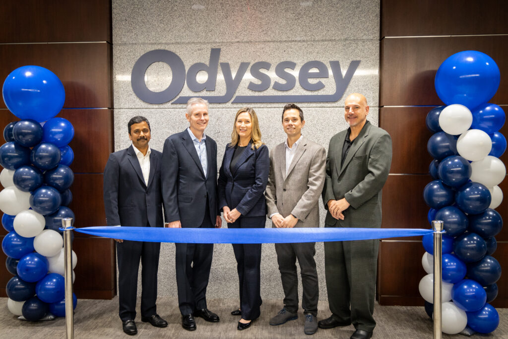 Members of Odyssey’s Executive Team standing next to each other at the ribbon cutting ceremony at the grand opening of the company’s new global headquarters in Charlotte, N.C.
